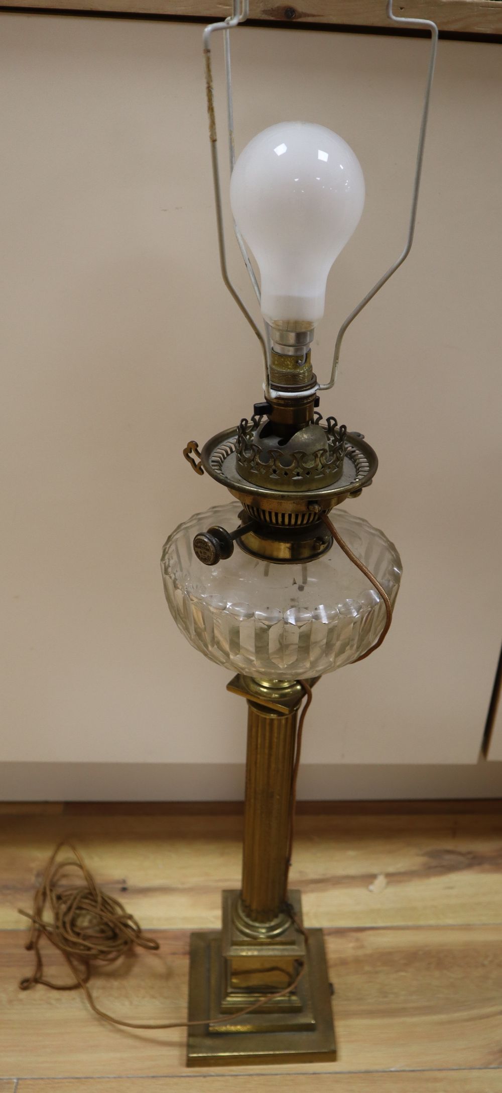 A Victorian brass stem oil lamp, height 58cm excl light fitting